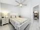 Bright bedroom featuring a ceiling fan and light gray walls, offering a calming and inviting retreat at 4521 Eaglewood Dr, Leesburg, FL 34748