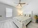 Bright bedroom with a ceiling fan and light gray walls, creating a serene and welcoming atmosphere at 4521 Eaglewood Dr, Leesburg, FL 34748