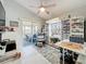 Bonus room featuring a ceiling fan and glass doors to lanai, offering a versatile space for hobbies at 4521 Eaglewood Dr, Leesburg, FL 34748