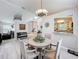 Inviting dining space connected to the living room, with a clear view of the kitchen at 4521 Eaglewood Dr, Leesburg, FL 34748