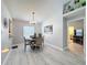 Well-lit dining area featuring a neutral color palette and an adjacent living space at 4521 Eaglewood Dr, Leesburg, FL 34748