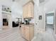 Bright entryway featuring a built-in beverage center and an open view into the living room at 4521 Eaglewood Dr, Leesburg, FL 34748