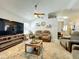 Spacious living room featuring neutral walls, a ceiling fan, and stylish decor at 4521 Eaglewood Dr, Leesburg, FL 34748