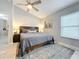 Inviting main bedroom featuring a ceiling fan, comfortable furnishings, and lots of natural light at 4521 Eaglewood Dr, Leesburg, FL 34748