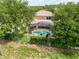Aerial view showcasing a screened-in pool and spacious backyard at 4548 Barrister Dr, Clermont, FL 34711