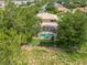 Aerial view of a home with a screened-in pool and well-maintained backyard at 4548 Barrister Dr, Clermont, FL 34711