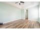 Spacious bedroom with wood floors, ceiling fan, and closet at 4548 Barrister Dr, Clermont, FL 34711