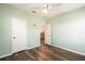 This cozy bedroom has hardwood floors at 4548 Barrister Dr, Clermont, FL 34711