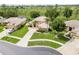 Charming single Gathering home featuring a well-manicured lawn, palm trees, and a circular driveway at 4548 Barrister Dr, Clermont, FL 34711