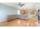 Open-concept living room features wood floors and a connecting kitchen at 4548 Barrister Dr, Clermont, FL 34711