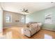 Spacious living room with hardwood floors, ceiling fan and lots of natural light at 4548 Barrister Dr, Clermont, FL 34711