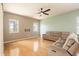 Spacious living room with hardwood floors, ceiling fan and lots of natural light at 4548 Barrister Dr, Clermont, FL 34711