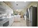 Bright and spacious kitchen with stainless steel appliances and ample counter space at 4904 Long Meadow Dr, Leesburg, FL 34748