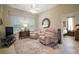 Cozy sitting area featuring two plush recliners, a window, and neutral decor at 4904 Long Meadow Dr, Leesburg, FL 34748