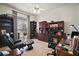 Comfortable home office features a ceiling fan, large built-in desk, and comfortable seating at 4904 Long Meadow Dr, Leesburg, FL 34748
