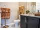 Cozy bathroom with granite countertops, neutral paint, and bronze-colored accents at 525 Narrow View Ln, Groveland, FL 34736