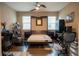 Home office with a wall bed system, hardwood flooring, and functional workspace setup as a bedroom at 525 Narrow View Ln, Groveland, FL 34736