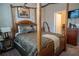 Spacious bedroom with four-poster bed, neutral color scheme, and coordinated decor at 525 Narrow View Ln, Groveland, FL 34736