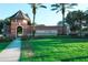 Landscaped entrance to the Trilogy community with palm trees and attractive signage at 525 Narrow View Ln, Groveland, FL 34736