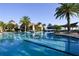 View of a large, outdoor swimming pool featuring lap lanes, and lounge chairs at 525 Narrow View Ln, Groveland, FL 34736