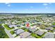 Aerial view of the property showcasing its location with water views, green spaces, and residential neighborhoods at 5311 Eads Ter, The Villages, FL 32163
