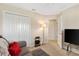 Bedroom features a comfortable seating area with sleeper sofa and a large closet at 5311 Eads Ter, The Villages, FL 32163