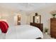 Spacious main bedroom with a large closet, neutral paint and carpet and access to bathroom at 5311 Eads Ter, The Villages, FL 32163