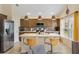 Kitchen with breakfast bar, stainless steel appliances and ample cabinet space for all your storage needs at 5311 Eads Ter, The Villages, FL 32163