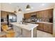 Beautiful kitchen features a breakfast bar, stainless steel appliances, and great cabinet storage space at 5311 Eads Ter, The Villages, FL 32163
