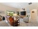 Comfortable living room featuring a large screen television and comfortable seating at 5311 Eads Ter, The Villages, FL 32163