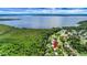 An aerial view of the house, community, and the lake nearby at 5319 Eagles Nest Rd, Fruitland Park, FL 34731