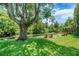 Benches in the backyard overlook a serene view of the creek at 5319 Eagles Nest Rd, Fruitland Park, FL 34731
