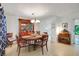Cozy dining room featuring wood table and view into the kitchen at 5319 Eagles Nest Rd, Fruitland Park, FL 34731