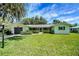 Charming single story home with lush green lawn and attached garage at 5319 Eagles Nest Rd, Fruitland Park, FL 34731