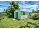 Exterior shot of a well-maintained storage shed in the backyard, ideal for storing tools and equipment at 5319 Eagles Nest Rd, Fruitland Park, FL 34731