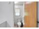 Cozy toilet room with classic fixtures and a window for natural light at 5319 Eagles Nest Rd, Fruitland Park, FL 34731