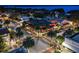 Aerial view of downtown with palm trees, illuminated buildings, and outdoor seating at restaurants during evening at 622 W 11Th Ave, Mount Dora, FL 32757