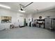 Spacious two-car garage with epoxy floors, storage, a golf bag and overhead lighting at 622 W 11Th Ave, Mount Dora, FL 32757