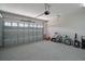 Finished two-car garage with epoxy floors, storage, and overhead door at 622 W 11Th Ave, Mount Dora, FL 32757