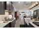 Open kitchen layout flowing into living room with white countertops and farmhouse sink at 622 W 11Th Ave, Mount Dora, FL 32757