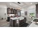 Kitchen with island, stainless appliances, custom cabinets, and a view of the backyard at 622 W 11Th Ave, Mount Dora, FL 32757