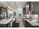 Kitchen featuring white countertops, stainless appliances, and eat-in island with sink at 622 W 11Th Ave, Mount Dora, FL 32757