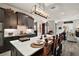 Bright kitchen with center island, modern countertops, and seating at the island at 622 W 11Th Ave, Mount Dora, FL 32757