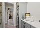 Modern laundry room featuring a stackable washer/dryer, grey cabinetry, and bright white countertops at 622 W 11Th Ave, Mount Dora, FL 32757