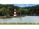 Image of a red and white striped lighthouse near a lake at 622 W 11Th Ave, Mount Dora, FL 32757