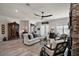 Bright living room with hardwood floors, neutral decor, and a decorative cabinet at 622 W 11Th Ave, Mount Dora, FL 32757