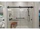 The bathroom includes a modern shower featuring a clear sliding door and a sleek black shower system at 622 W 11Th Ave, Mount Dora, FL 32757