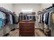 Spacious walk-in closet provides ample storage and organization with custom shelves, drawers and hanging racks at 622 W 11Th Ave, Mount Dora, FL 32757