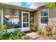 Exterior view of enclosed lanai with a view to plants and landscaping at 6906 Glenbrook Dr, Lakeland, FL 33811