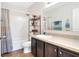 Well-lit bathroom with a shower-tub combo and a dark-wood vanity at 6906 Glenbrook Dr, Lakeland, FL 33811